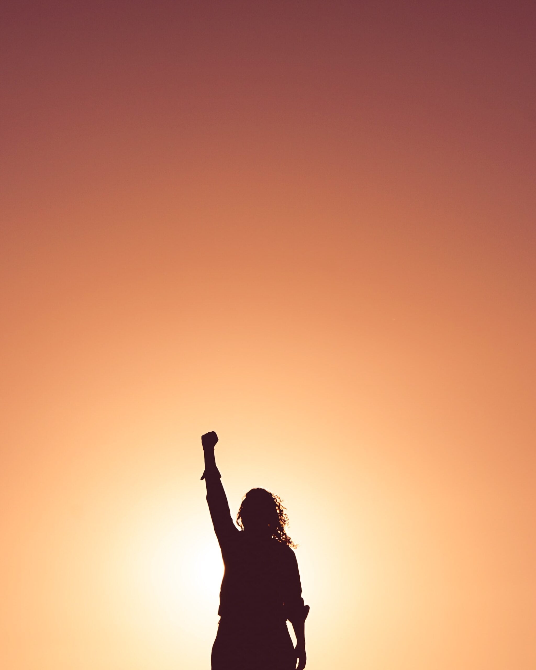 woman with arm raised